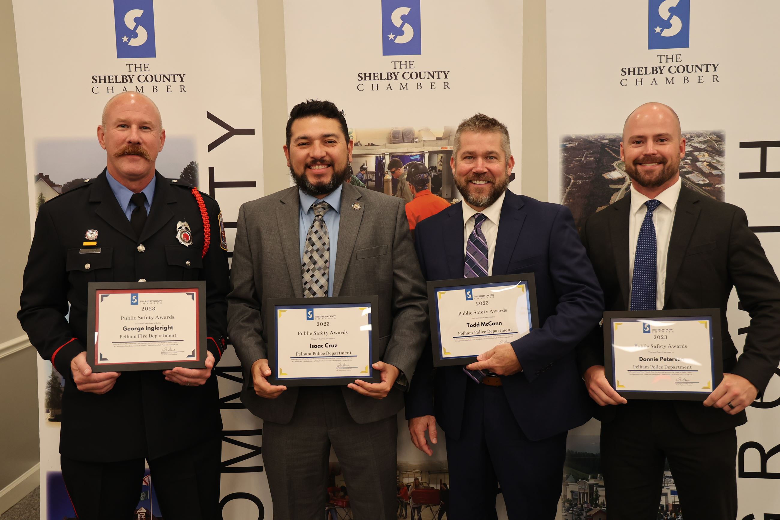 Members of the Pelham Police and Fire Departments display their Public Safety Awards.
